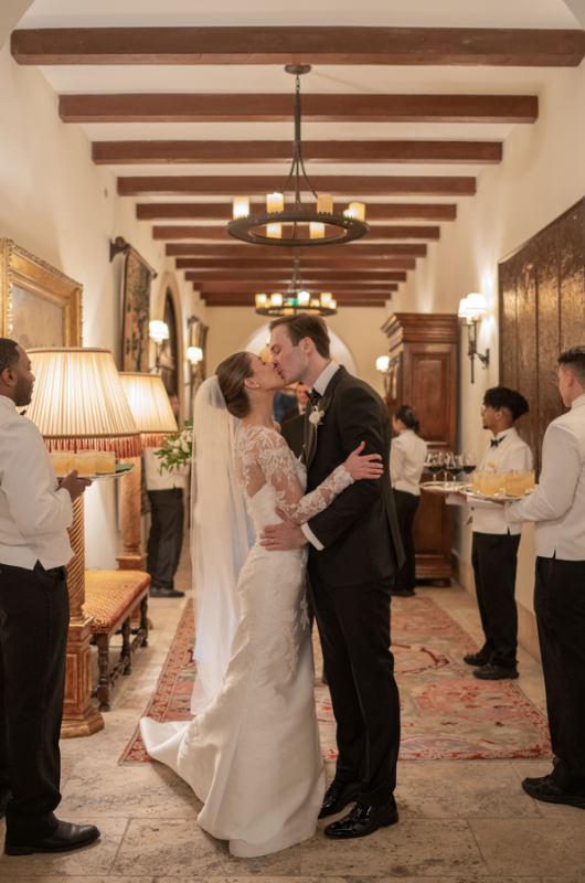 Julia Van de Bogart and John Rand Dorney real wedding ceremony kiss in hallway