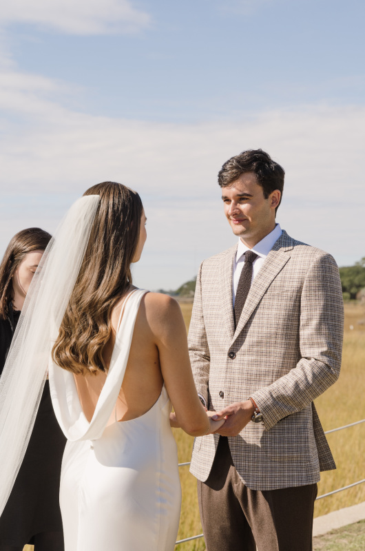 Tessa Soufrant and Ansel Huckabee Real Wedding groom ceremony view