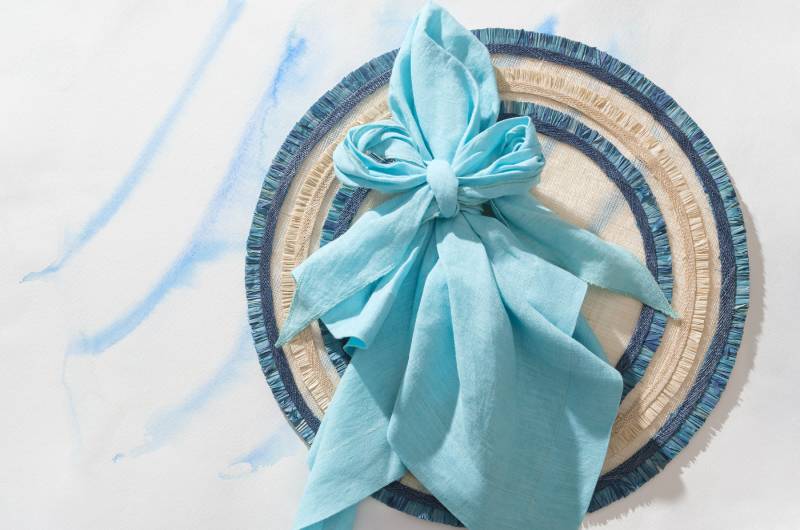 Entertaining In Bloom Spring Style Tips From Joanna Buchanan bow linen napkin raffia placemat
