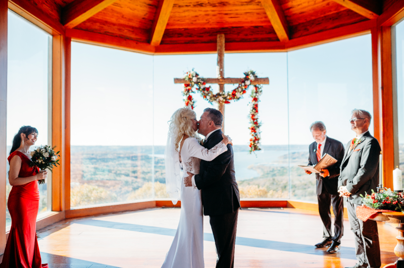 Sheila Basel & Wayne Wright real wedding couple kiss at altar