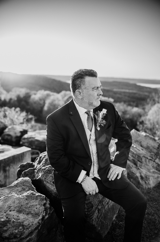 Sheila Basel & Wayne Wright real wedding groom on cliff Sheila Basel & Wayne Wright real wedding groom on cliff