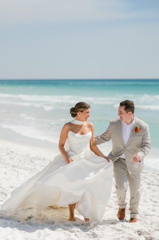 Seaside brideandgroom2 raebird-weddings-events-the-trendsetter-series-by-southern-bride-seaside-fl-bride-and-groom-running-on-the-beach