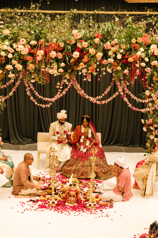 Magic in the City Traditional Indian Weddings at Andaz Mexico City outdoor ceremony bride and groom sitting Magic in the City Traditional Indian Weddings at Andaz Mexico City outdoor ceremony bride and groom sitting