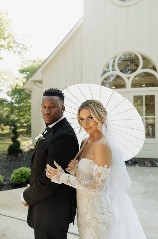 Shilee Hesman Antonio Sanders under umbrella