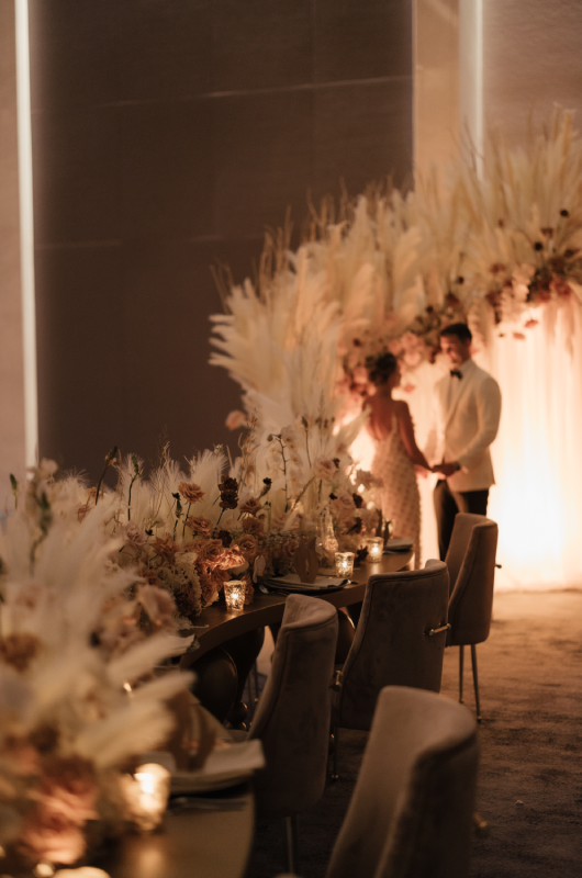 Stunning & Brilliant Events Named Trendsetter in Chicago couple at reception tall florals