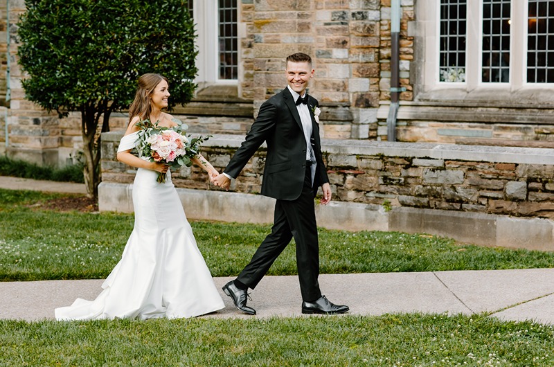 Karissa & Charles John Mironas IV holding hands