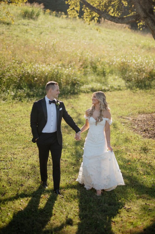 karissa haasz alex binnie holding hands in the field