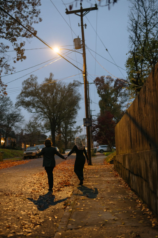 romantic midtown memphis proposal a photographer and musicians love story walking in Memphis