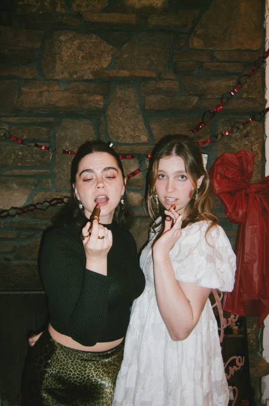 hearts art besties a galentine weekend in bentonville arkansas girls putting on lipstick