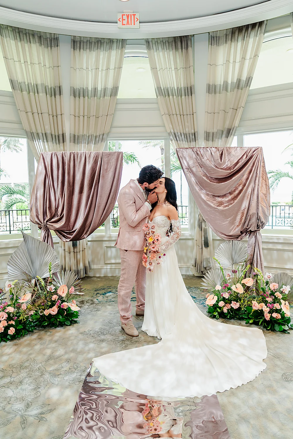 Mod Events Designs Eau Palm Beach newlyweds kissing indoor wedding Sia Weddings Photography