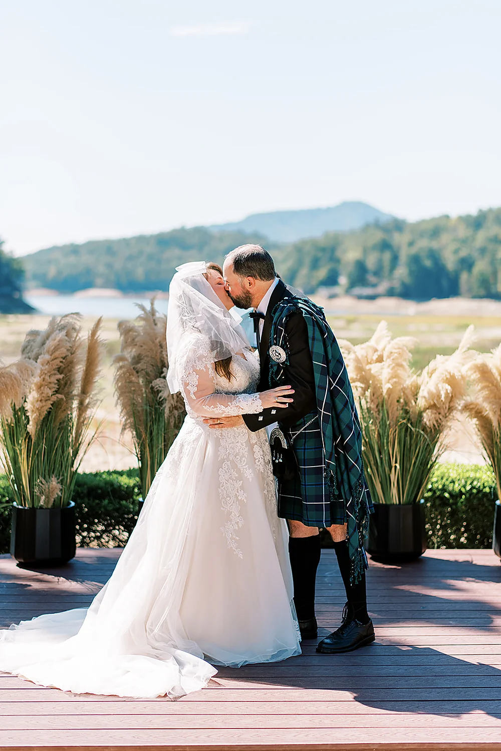 Christina Collins And Brian Gardner kissing couple outdoor wedding kilt North Carolina Meghan Rose Photography