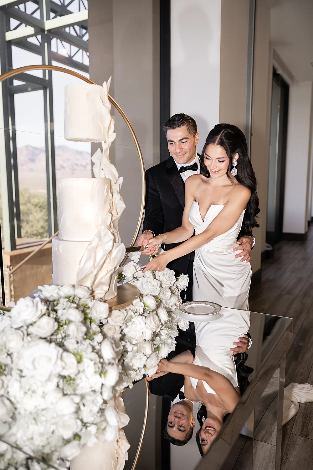 Love In Waves A Modern Luxury Wedding Editorial In Las Vegas bride groom cutting cake