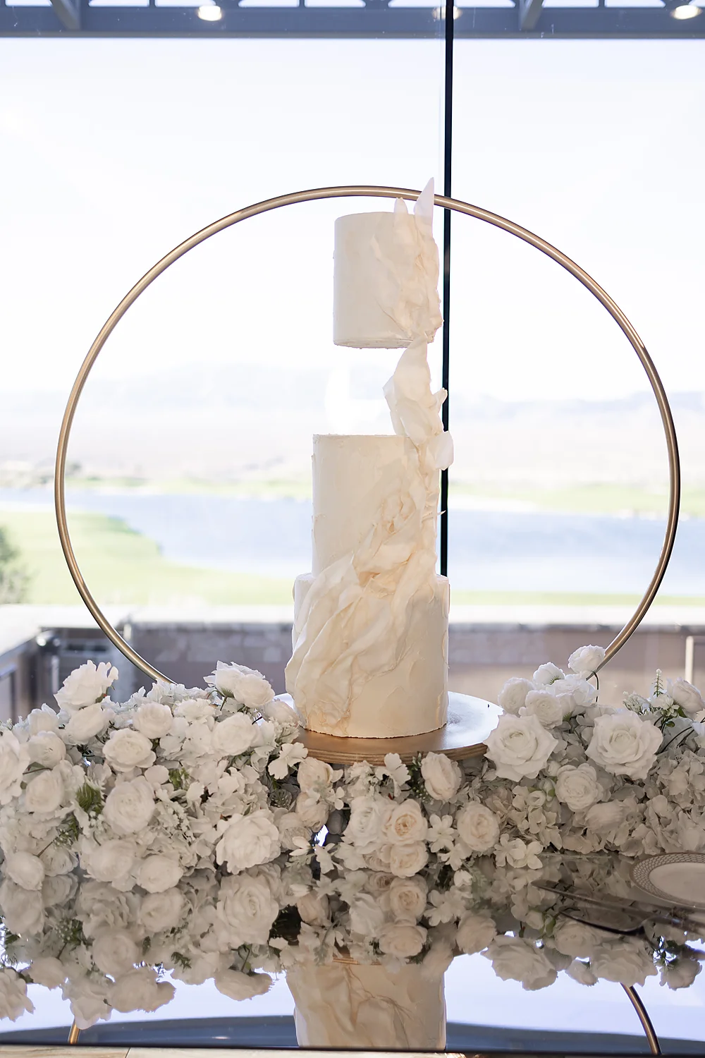 Love In Waves A Modern Luxury Wedding Editorial In Las Vegas elegant floating wedding cake floral display