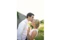 The Barefoot Bride sleeveless gown couple kiss 