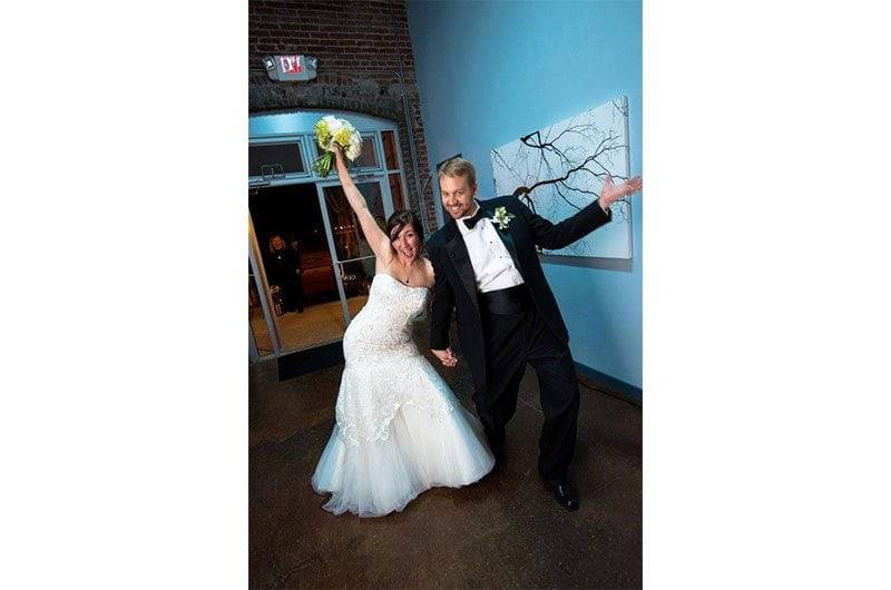 The Barefoot Bride strapless gown couple together at venue exit