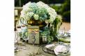 Elegant Chair Solutions table3 glassware gold linens flatware floral arrangement