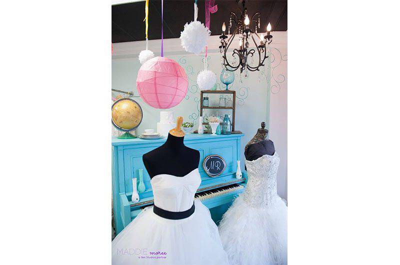 The Barefoot Bride blue piano white wedding dress on mannequins 