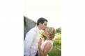 The Barefoot Bride sleeveless gown couple kiss 