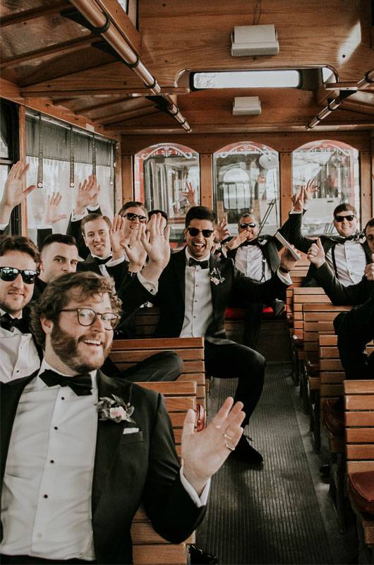 Paige Winesette And Drew Kiser Real Wedding Groom And Groomsmen On Trolley