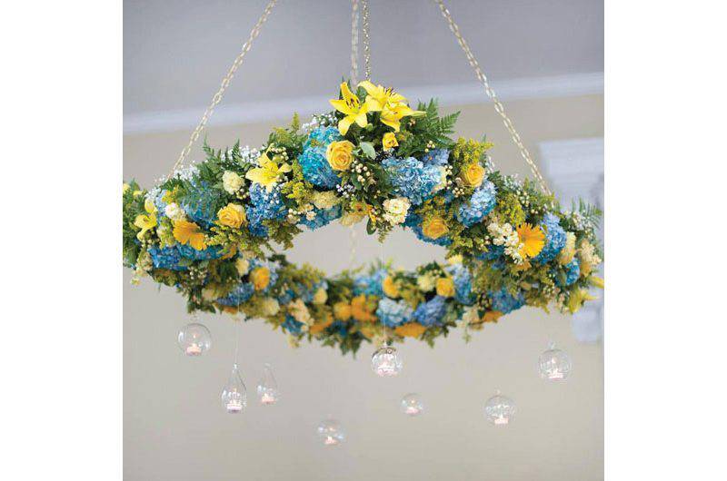 Weddings by Lulu hanging florals blue yellow decorations glass bauble lights