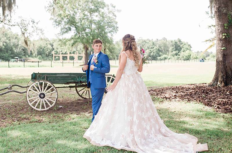 Brianna Geiger & Jimmy Nettles Bride And Groom Next To Wagon 