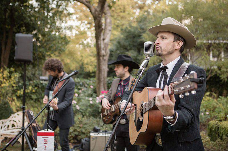 Jeremy Shrader Music live performance outdoors in suits