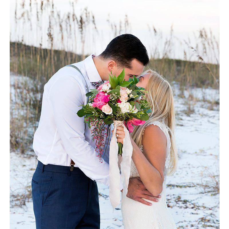 Taylor Wright Photography bouquet kissing snow background