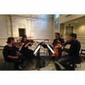 Simply Strings 4 piece cello violin viola performing inside venue