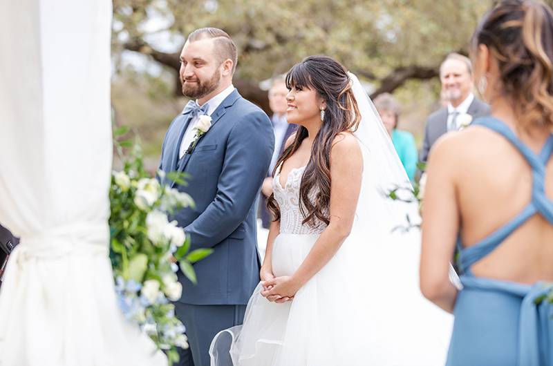 Emily Nguyen And Chase Henckel Standing At The Altar 