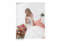Heather Cosmetics Bride holding white flower