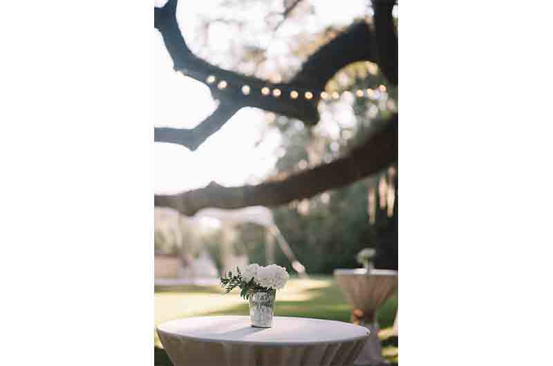 Wingate Plantation cocktail table wrapped in linens outdoors