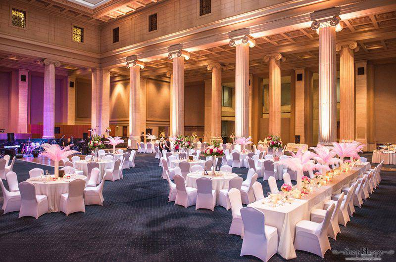 The Columns at One Commerce Square Bride Empty reception hall Wrapped chairs Long and Round Tables