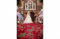 Historic Rice Mill outdoor wedding ceremony red rose petals