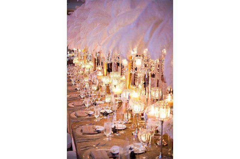Kelly Sherlock LLC table setting tall candles and feather centerpieces