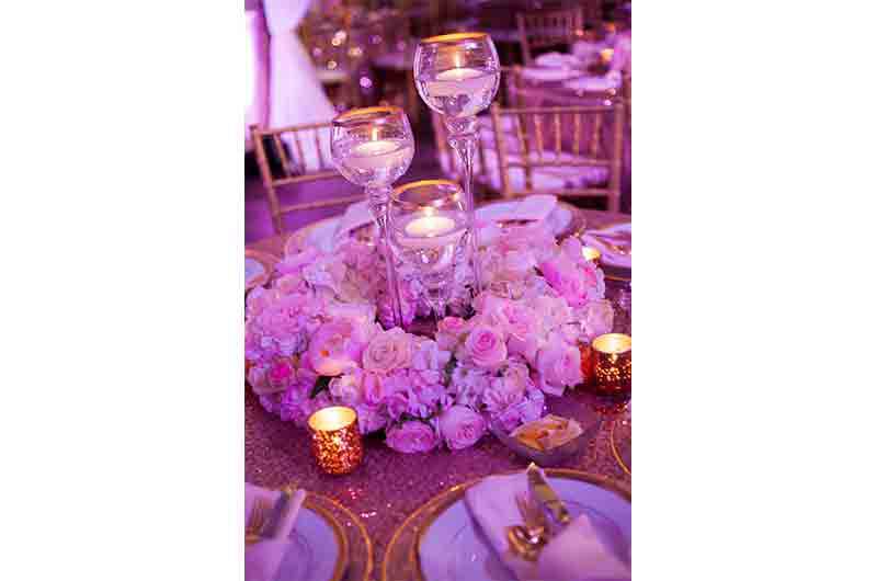 Cadre Building pink roses centerpiece floating candles