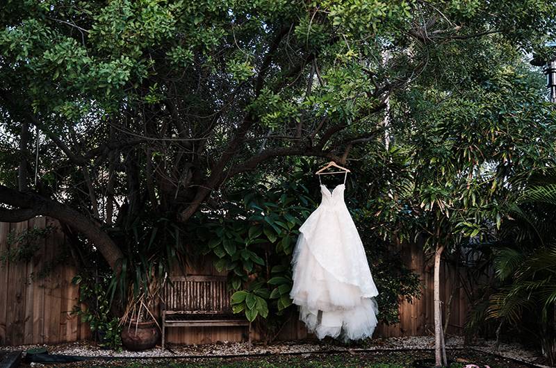 Arielle Clay & Steve Potea Wedding Dress Hanging In Garden