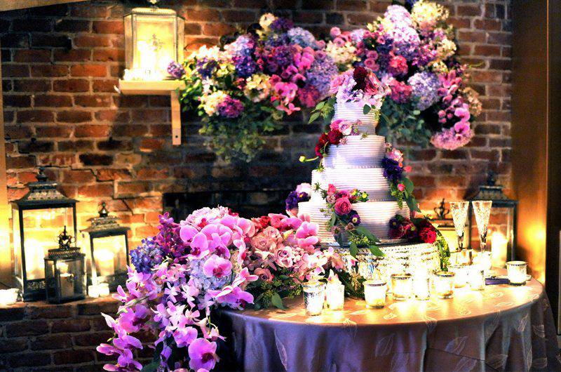 Bella Blooms Floral Tiered Purple wedding cake candle glasses lanterns