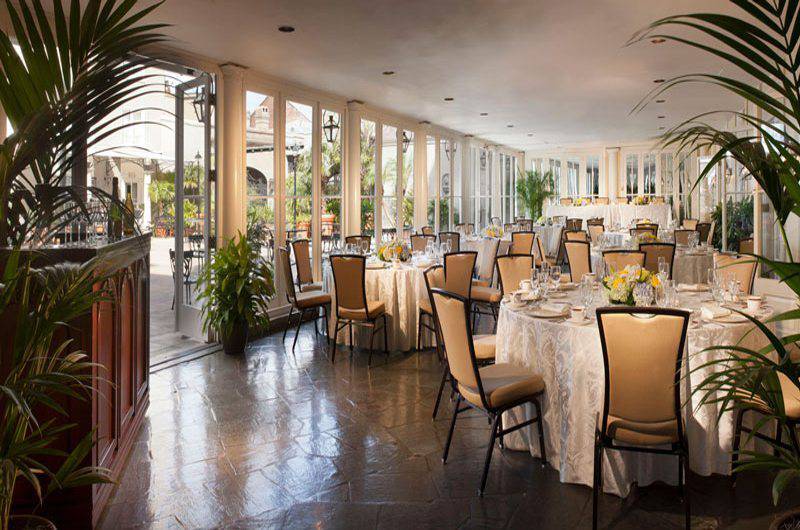 Omni Royal Orleans terrace dining room leather seating round tables