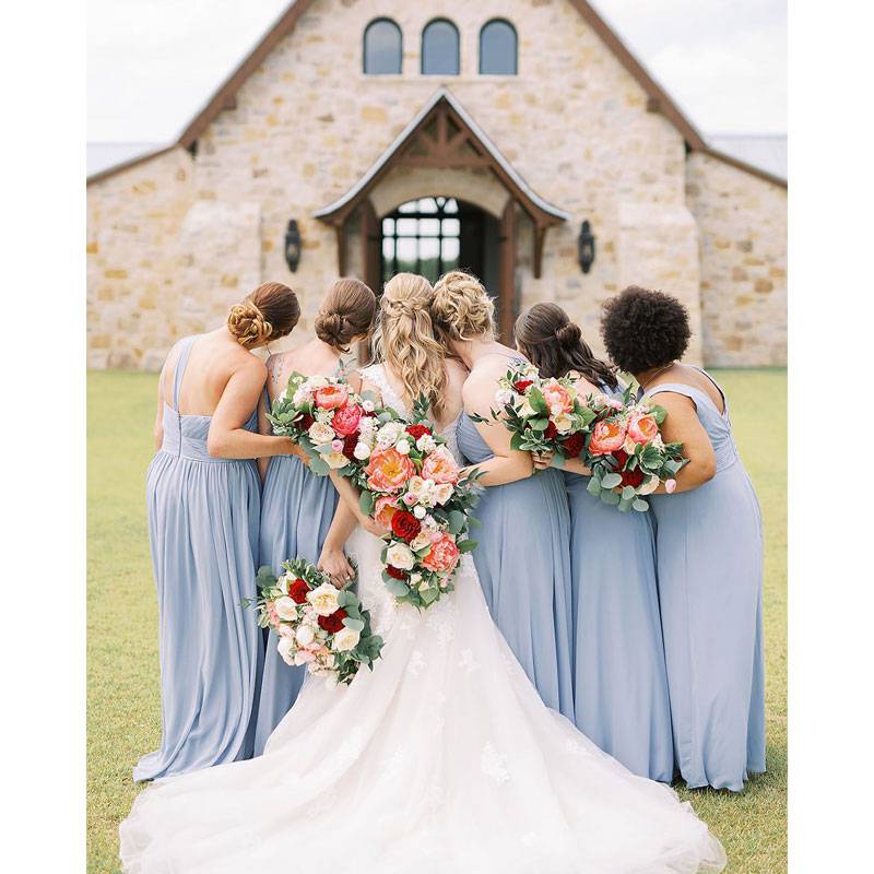 Hidden River Ranch Weddings & Events Bridal Party Huddled Together