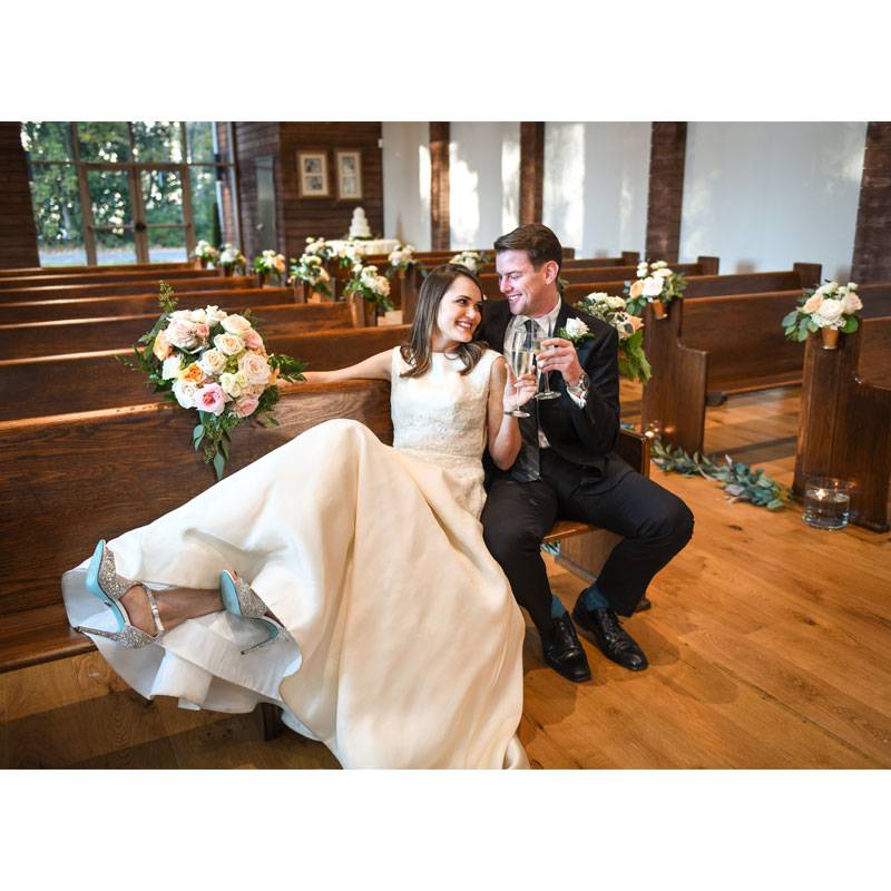 Gracelands Chapel In The Woods Bride And Groom Sitting On A Pew