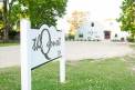 The Quonset Sign Feature Grid Image