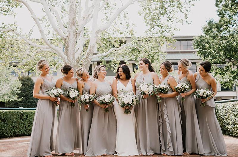 Tina Shtayyeh And Geno Tartell Bride With Bridal Party Laughing Under White Tree