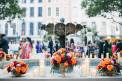 New Orleans Board of Trade Red Orange flower arrangements water fountain