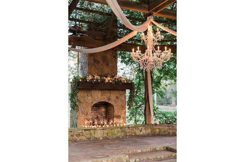 Signature Occasions fireplace candles with chandelier 