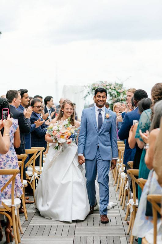 Carrie Henderson And Varun Kannan Bride And Groom Walking Down The Aisle (1)