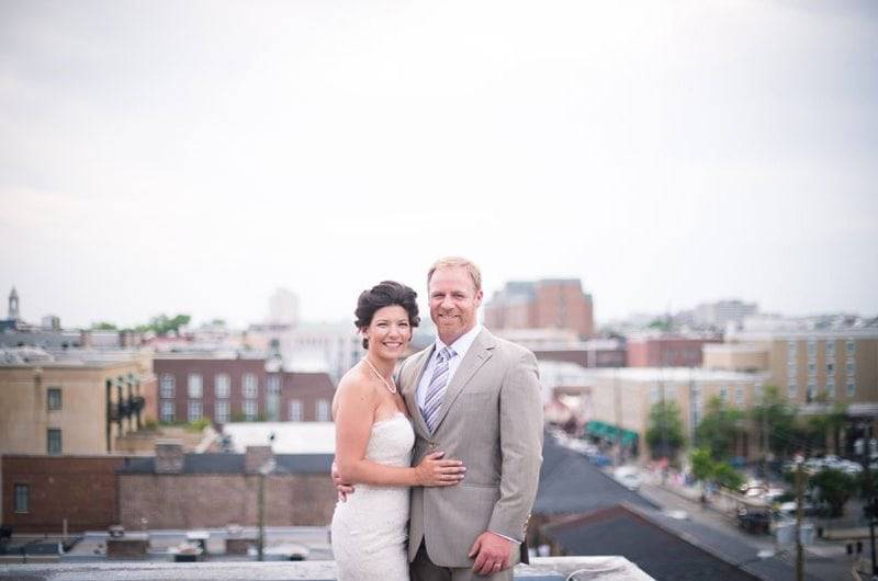 Molly Joseph Photography furniture Bride Groom rooftop view of city