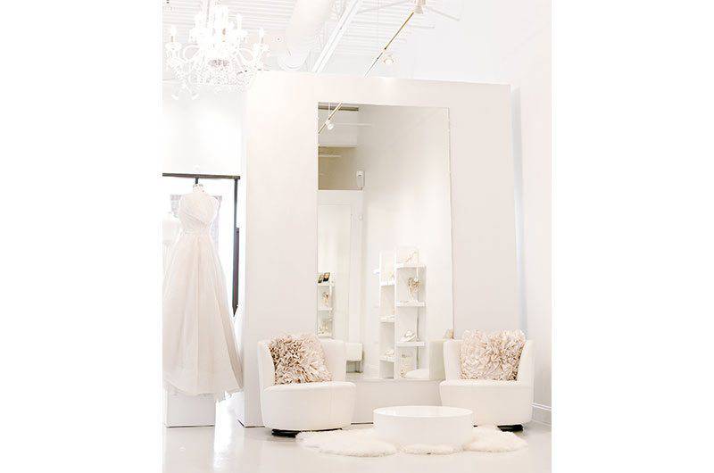 Maggie Louise Bridal bridal store interior white seating