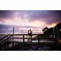 Golden Isles Georgia Couple Standing On Dock During Cloudy Sunset