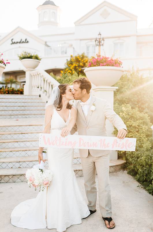 Courtney Hannan & Matthew Woltz Sandals Resort Bride And Groom Holding Sign 