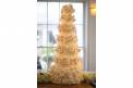 Signature Occasions tall wedding cake tiered with white flowers